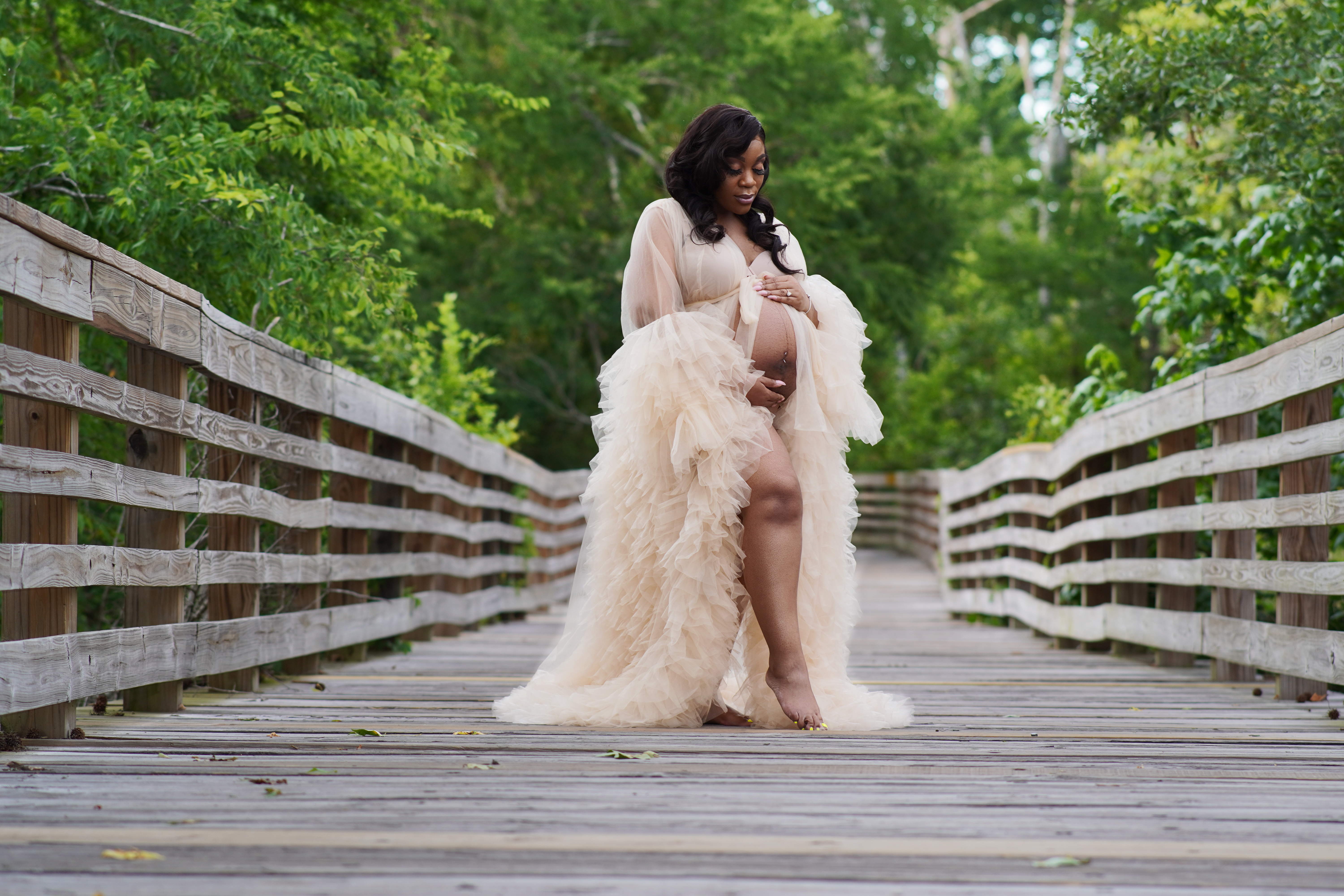 Maternity portrait on a wooden bridge by Media Circle in Decatur, GA